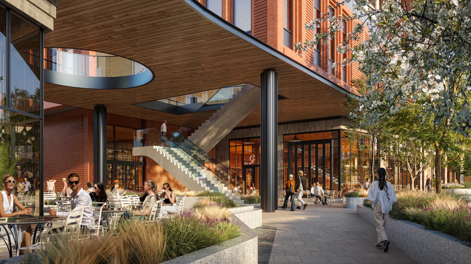 Outdoor café seating in a landscaped plaza beneath a wood-paneled overhang with visible oculus cutout.