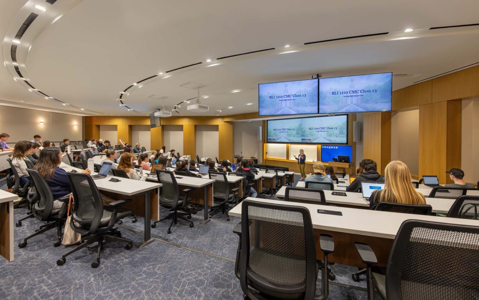 Active learning classroom at the SMU Cox School of Business with collaborative seating, digital displays, and flexible instructional layout.
