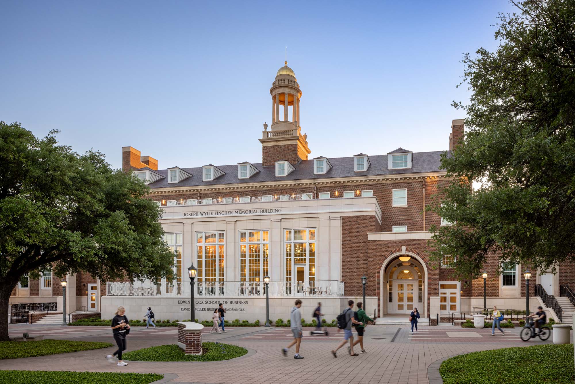 Georgian-style exterior of the SMU Cox School of Business with brick facade, cupola, and central entry facing the David B. Miller Business Quadrangle.