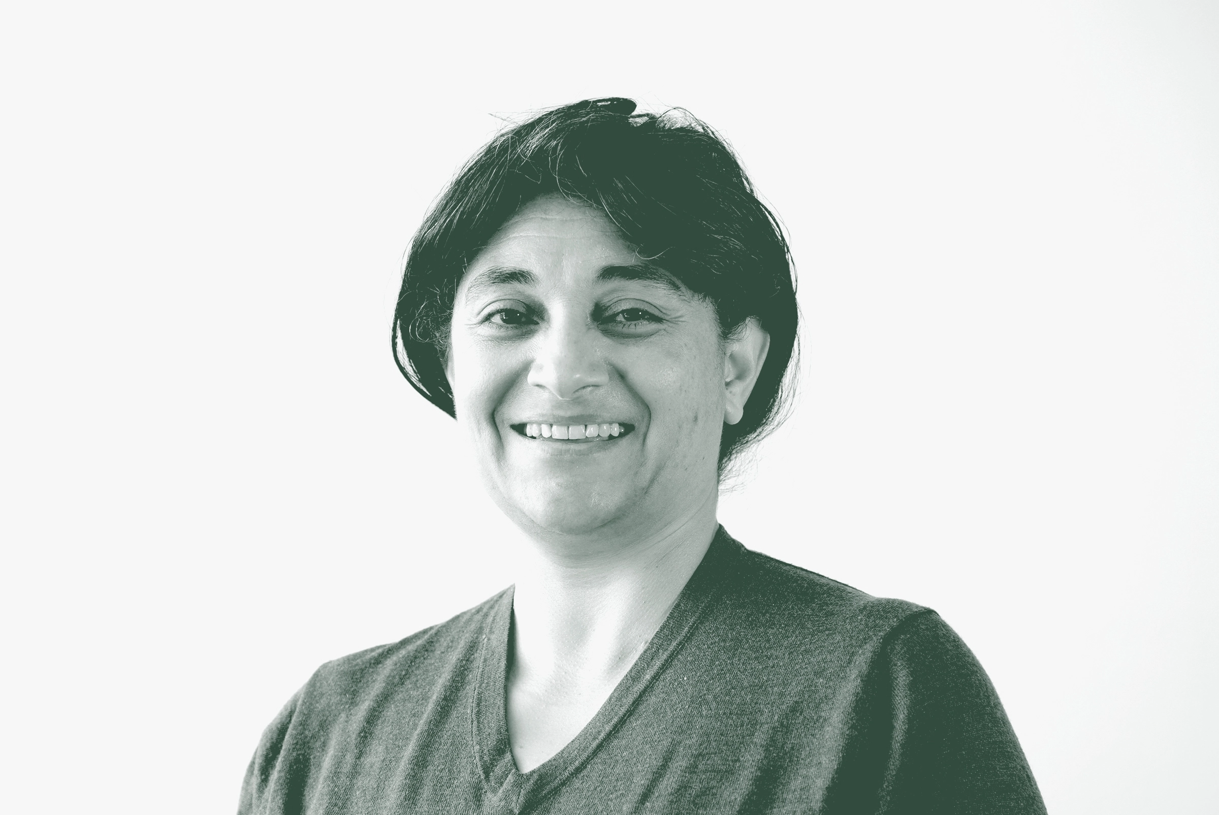 Nardine Mansi Portrait A black and white portrait of Nardine Mansi, an Associate and Senior Project Leader with GFF in the Retail & Hospitality Studio, in front of a white background.