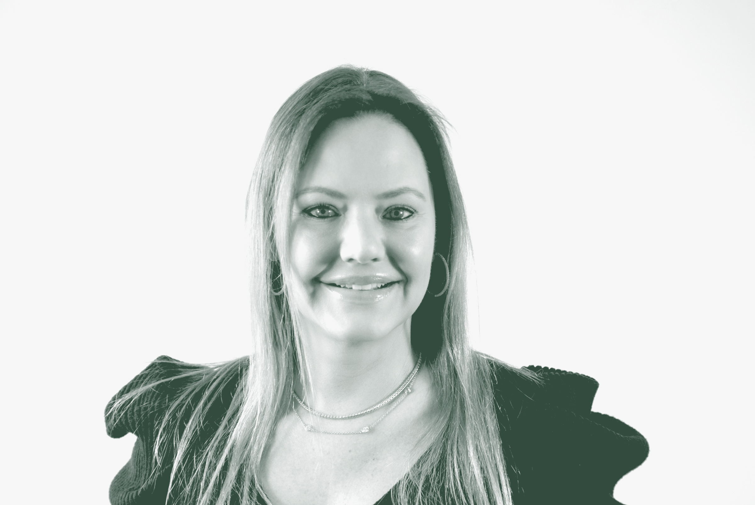 A black and white portrait of Allison Hubbard, a Principal, the President, and the Chief Operating Officer with GFF, in front of a white background.