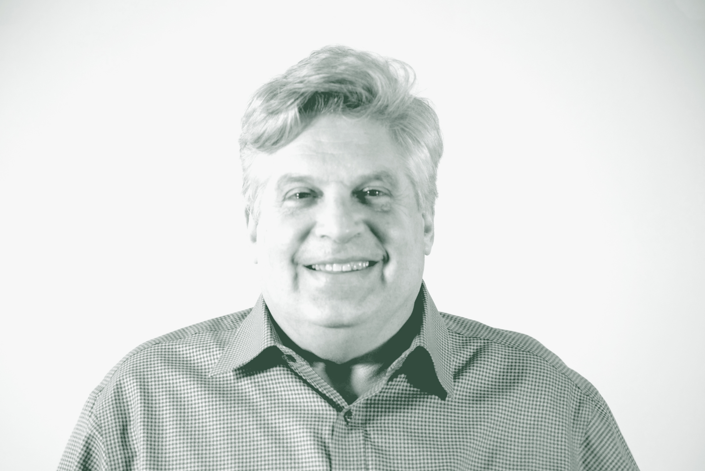 A black and white portrait of Lance Braht, an Associate Principal and Senior Design Leader with GFF, in front of a white background.