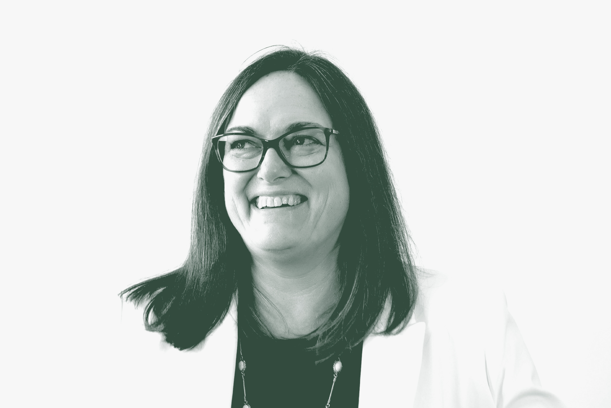 A black and white portrait of Laura Cornell, an Associate Principal and the Director of Landscape Architecture with GFF in the Landscape Architecture Studio, in front of a white background.