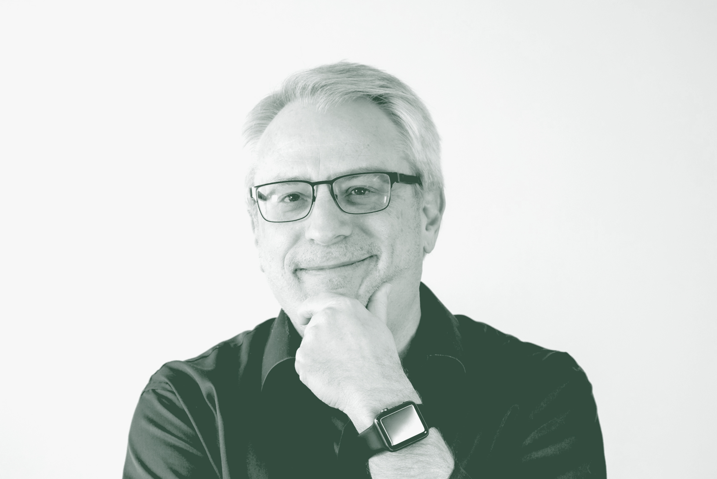 A black and white portrait of Lonnie Burns, an Associate Principal and Studio Director with GFF in the Fort Worth Studio, in front of a white background.