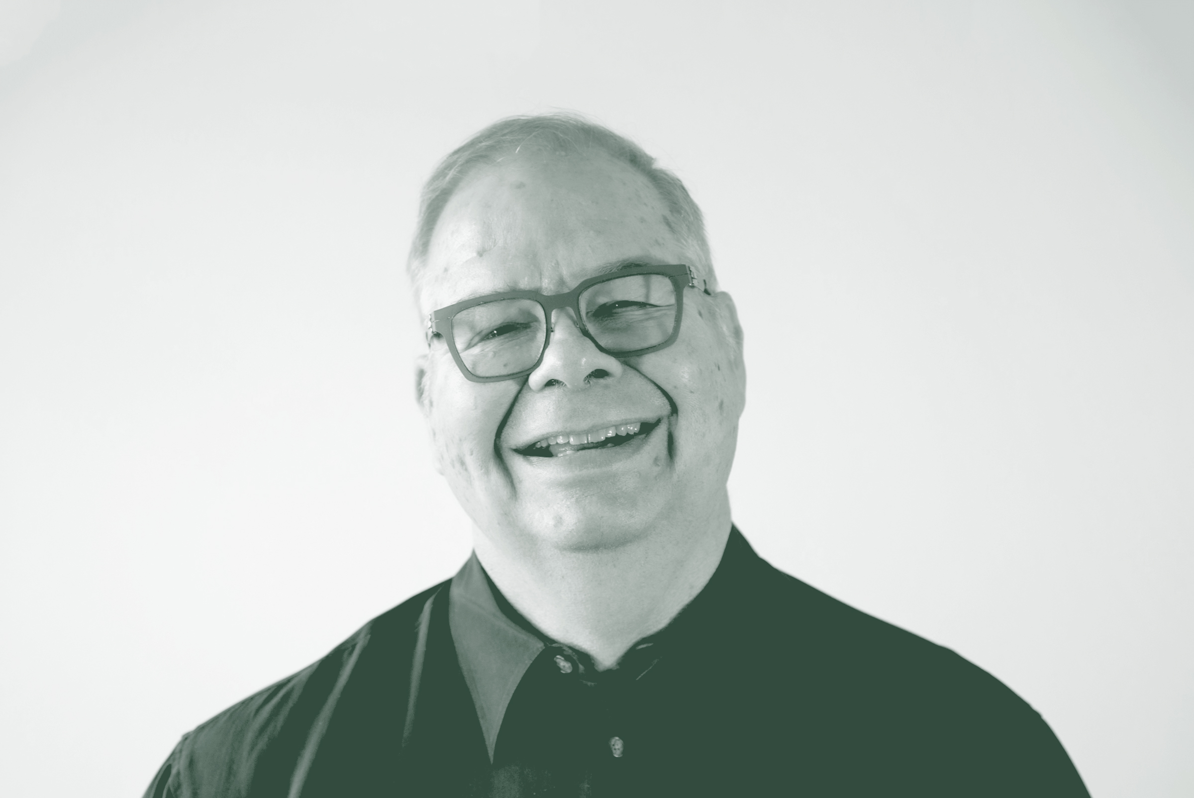 A black and white portrait of Donald R. Kubala, an Associate Principal and Senior Project Leader with GFF in the Faith & Community Studio, in front of a white background.
