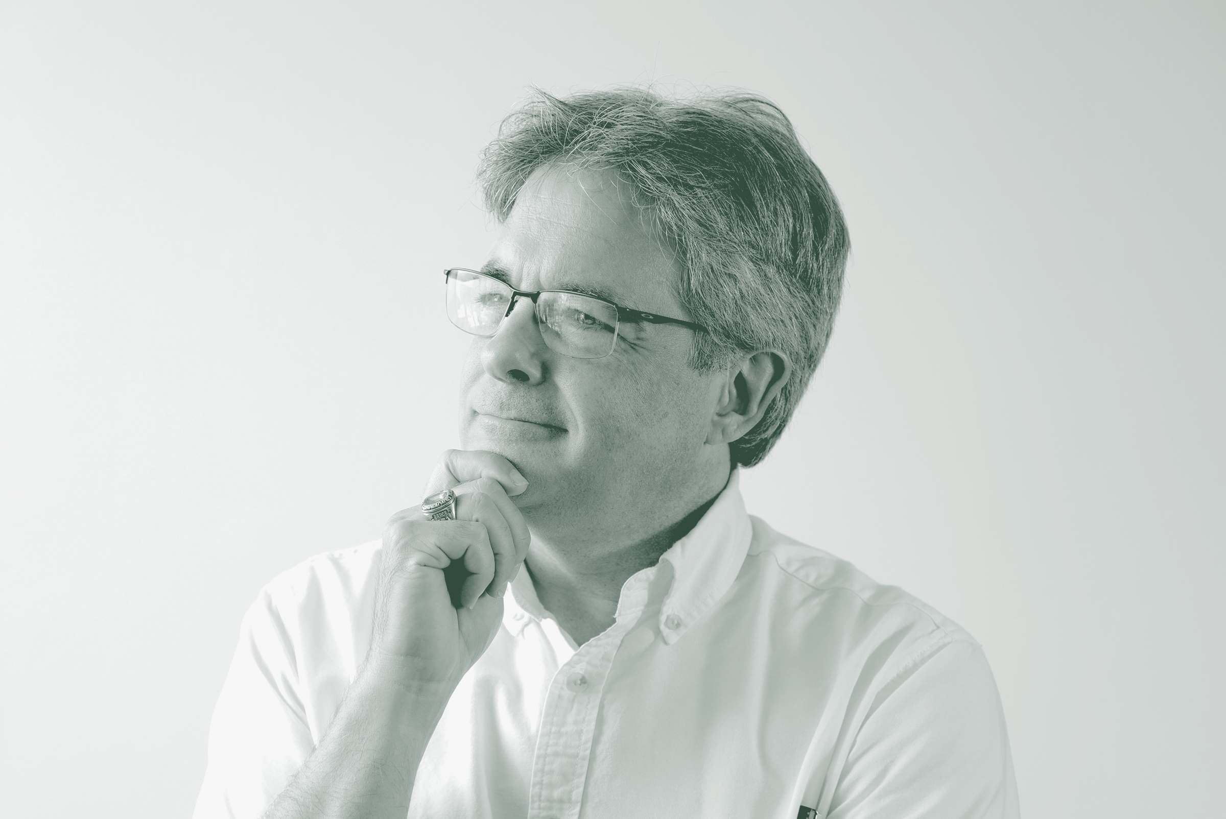 A black and white portrait of Scott Kanaga, an Associate Principal and Studio Director with GFF in the Retail Studio, in front of a white background.