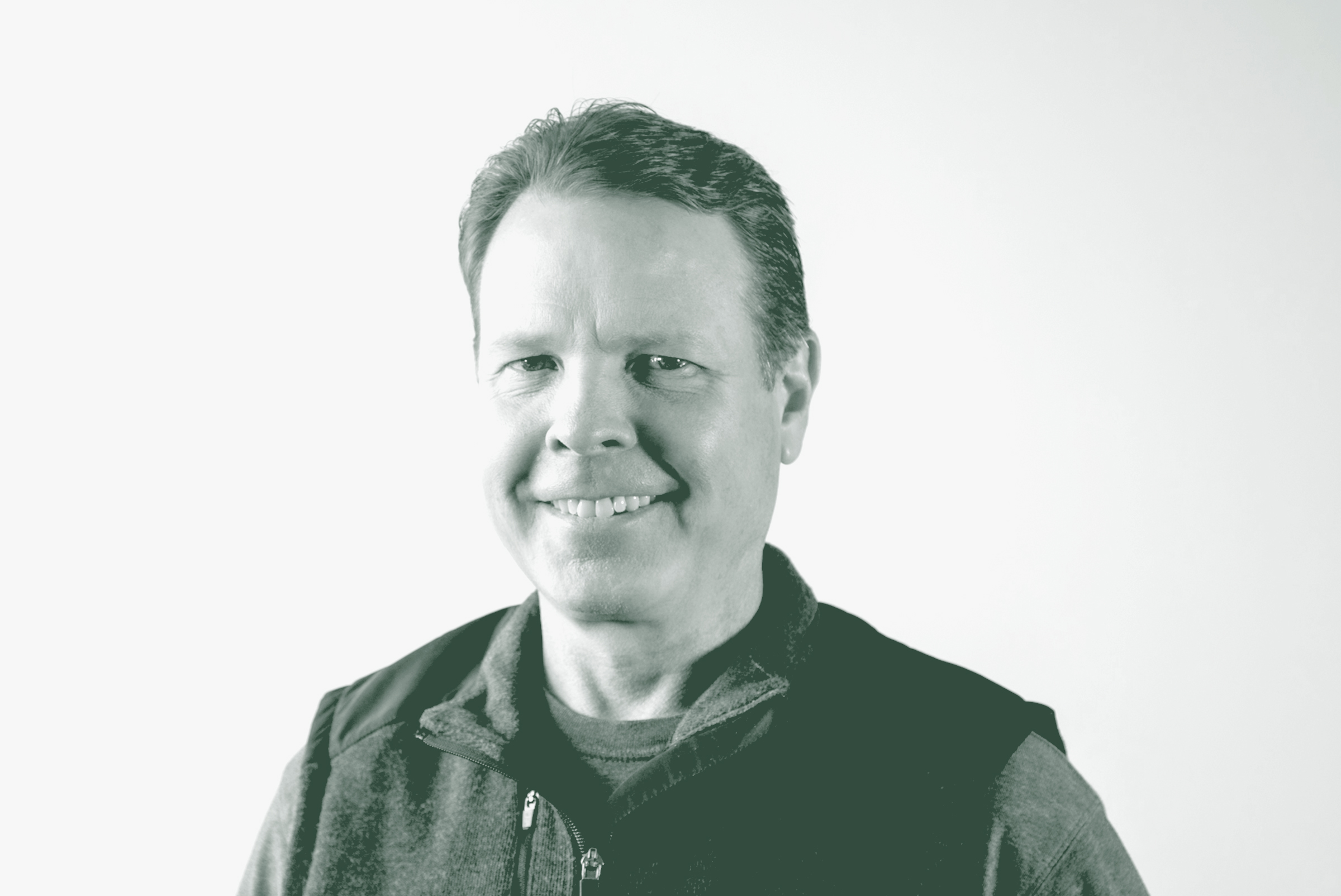 A black and white portrait of Kent Pontious, an Associate Principal and Studio Director with GFF in the Mixed-Use & Multifamily Studio, in front of a white background.