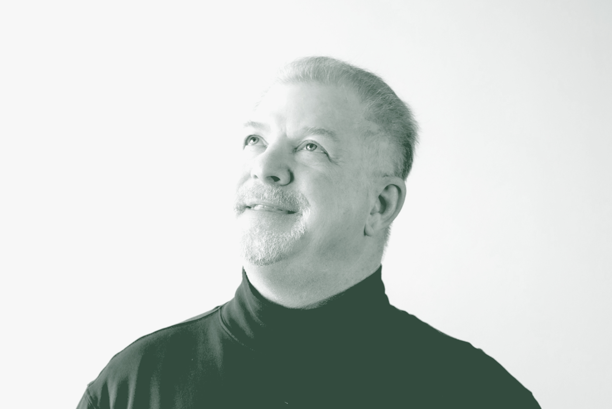 A black and white portrait of David Swaim, an Associate Principal and the Director of Construction Administration with GFF, in front of a white background.