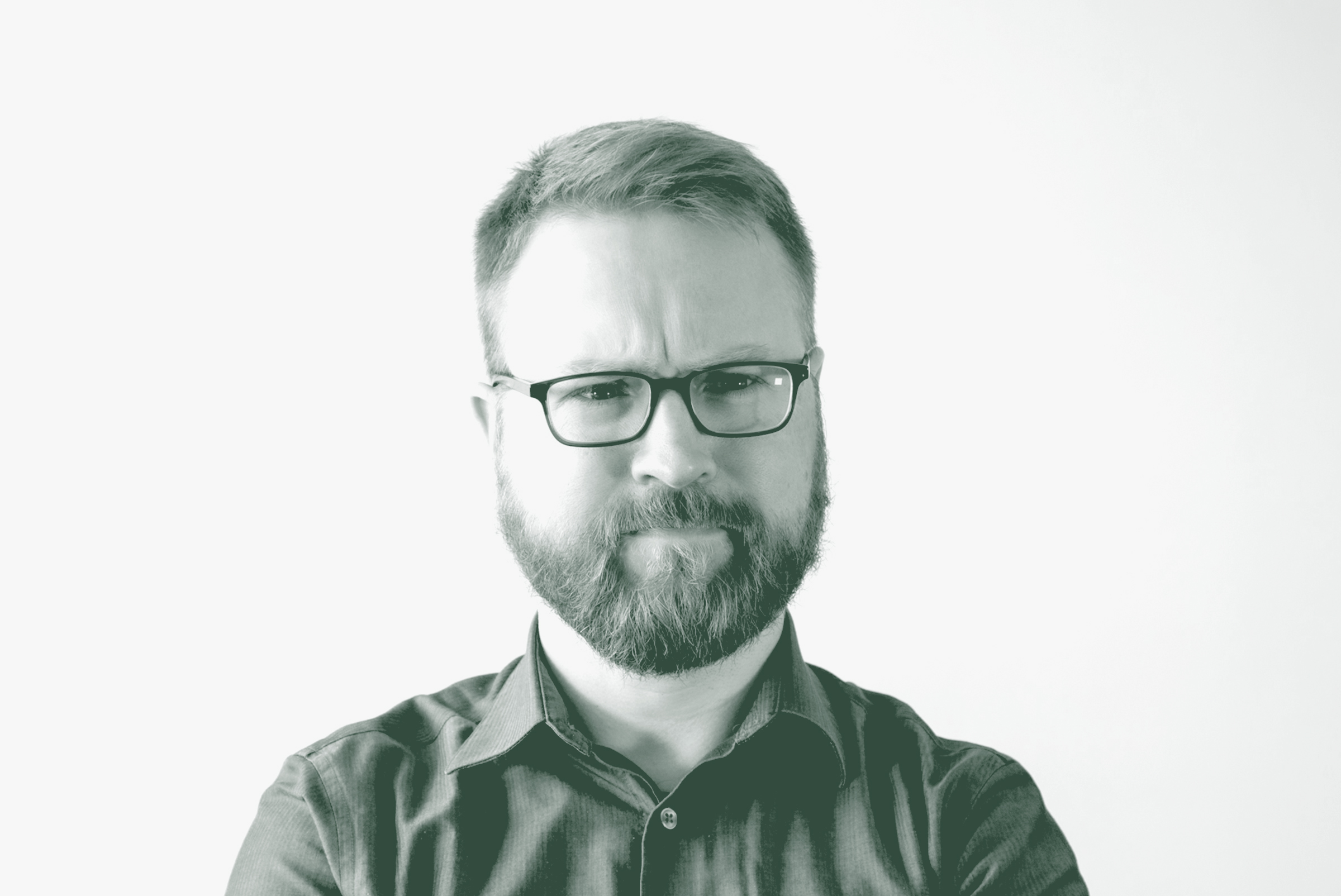 A black and white portrait of Sam Stribling, an Associate and Studio Director with GFF in the Mixed-Use & Multifamily Studio, in front of a white background.