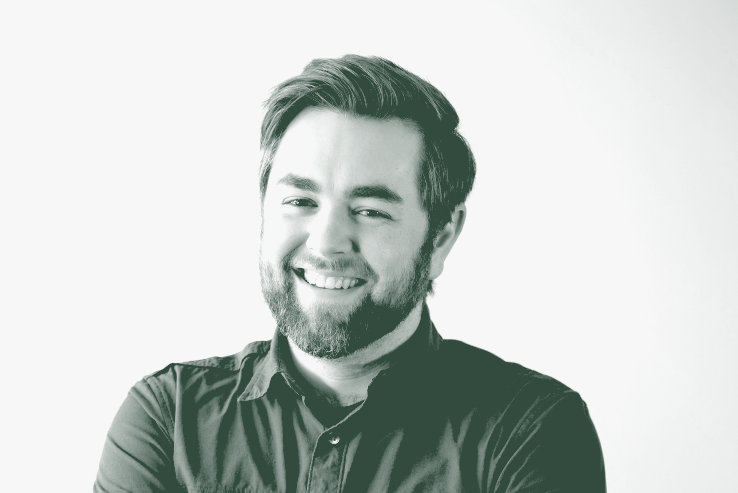 A black and white portrait of Josh Frederick, an Associate and Project Leader with GFF in the Mixed-Use & Multifamily Studio, in front of a white background.