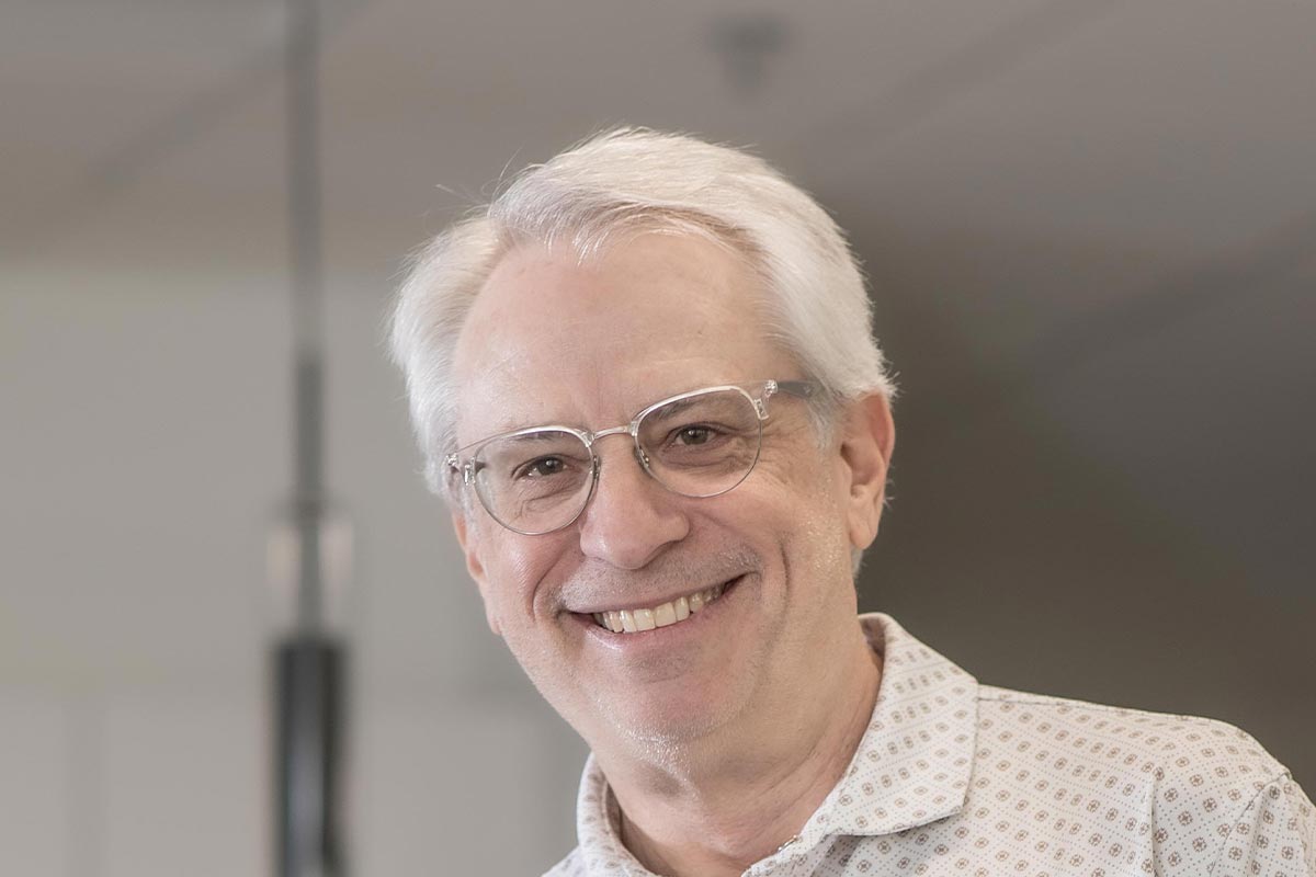 Lonnie Burns, AIA, Associate Principal and Studio Director at GFF, close-up portrait with soft indoor lighting.