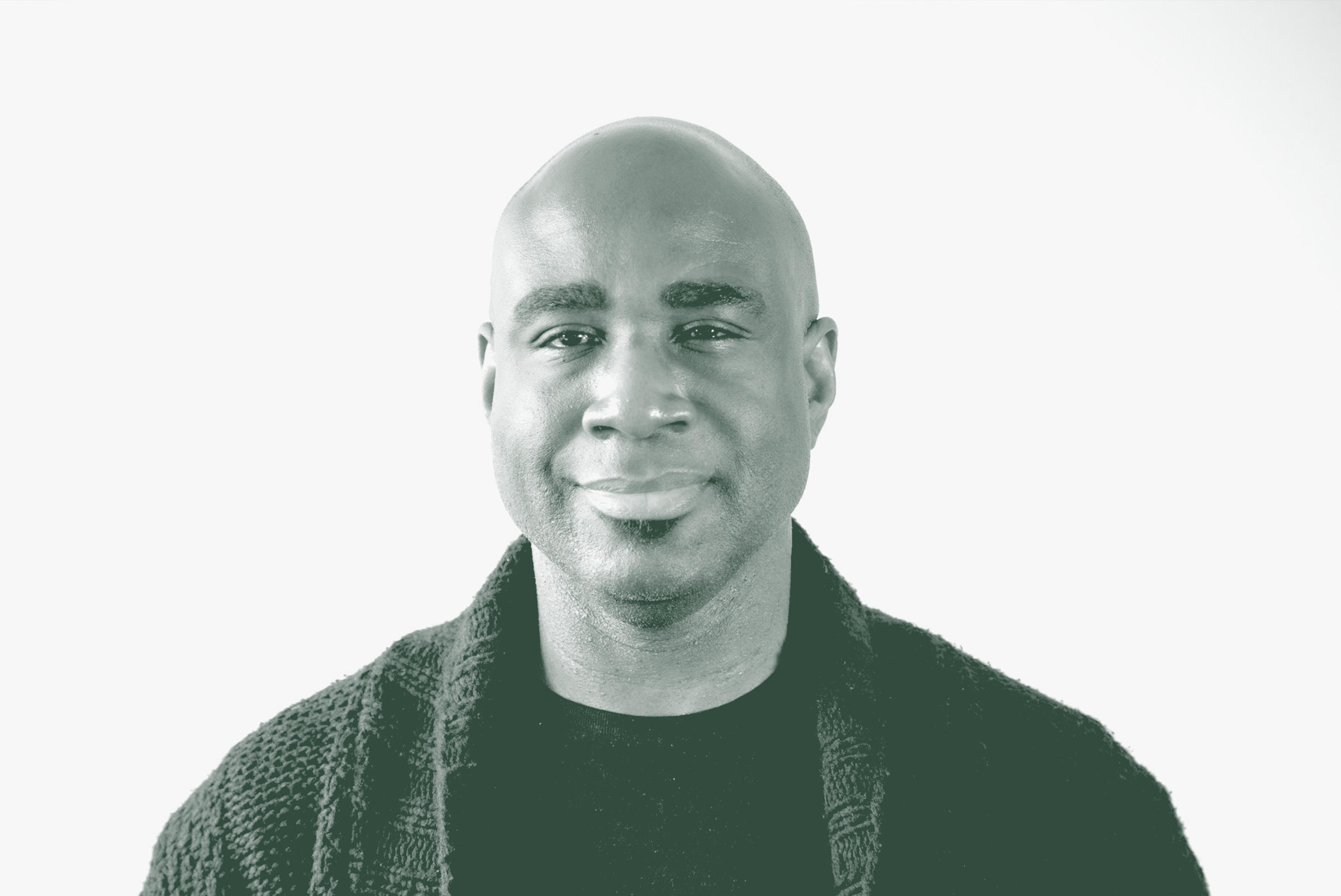 A black and white portrait of Keven Randolph, a Senior HR Leader with GFF, in front of a white background.
