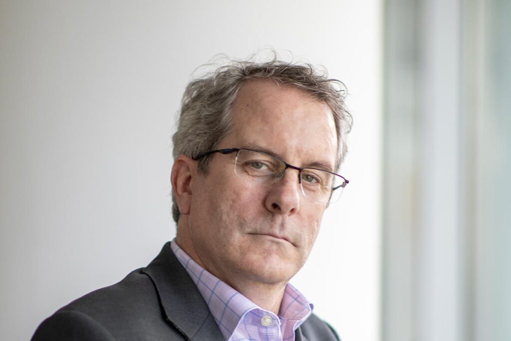 David Boone, Associate Principal and Senior Interior Design Leader at GFF, close-up professional portrait with glasses and soft natural lighting.