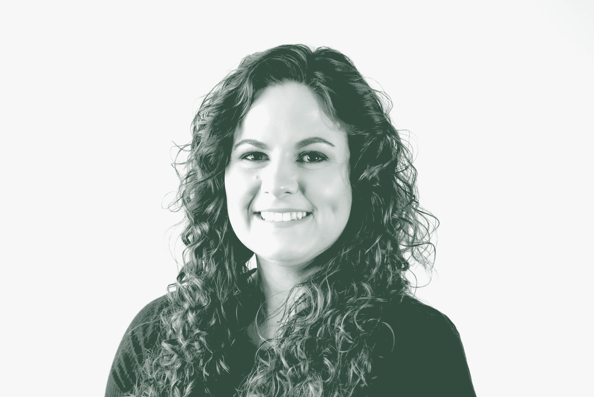 A black and white portrait of Nicole Capps, a Senior Project Coordinator with GFF in the Mixed-Use & Multifamily Studio, in front of a white background.