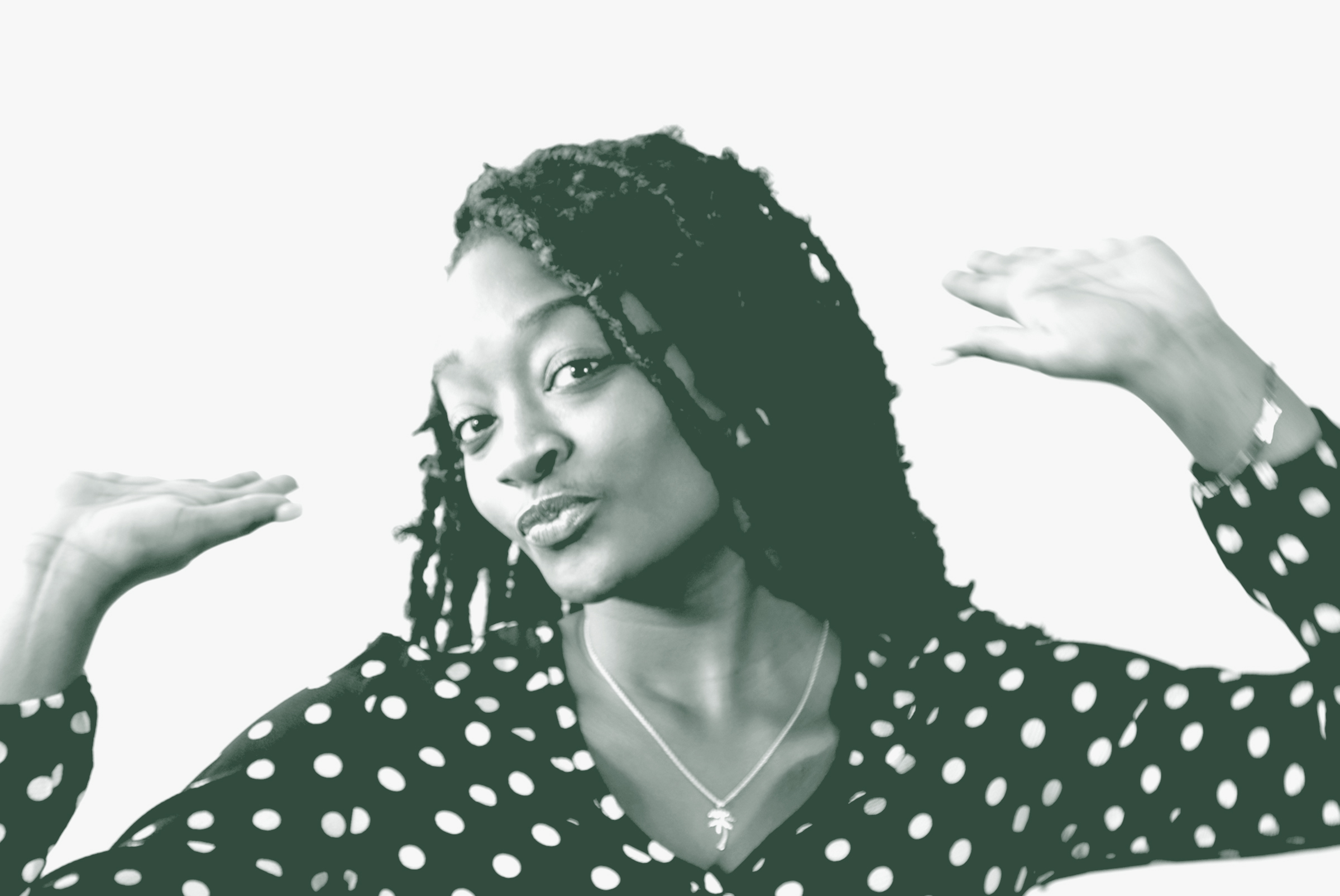 A black and white portrait of Bryana Cozart, an Interior Design Coordinator with GFF in the Faith & Community Studio, in front of a white background.