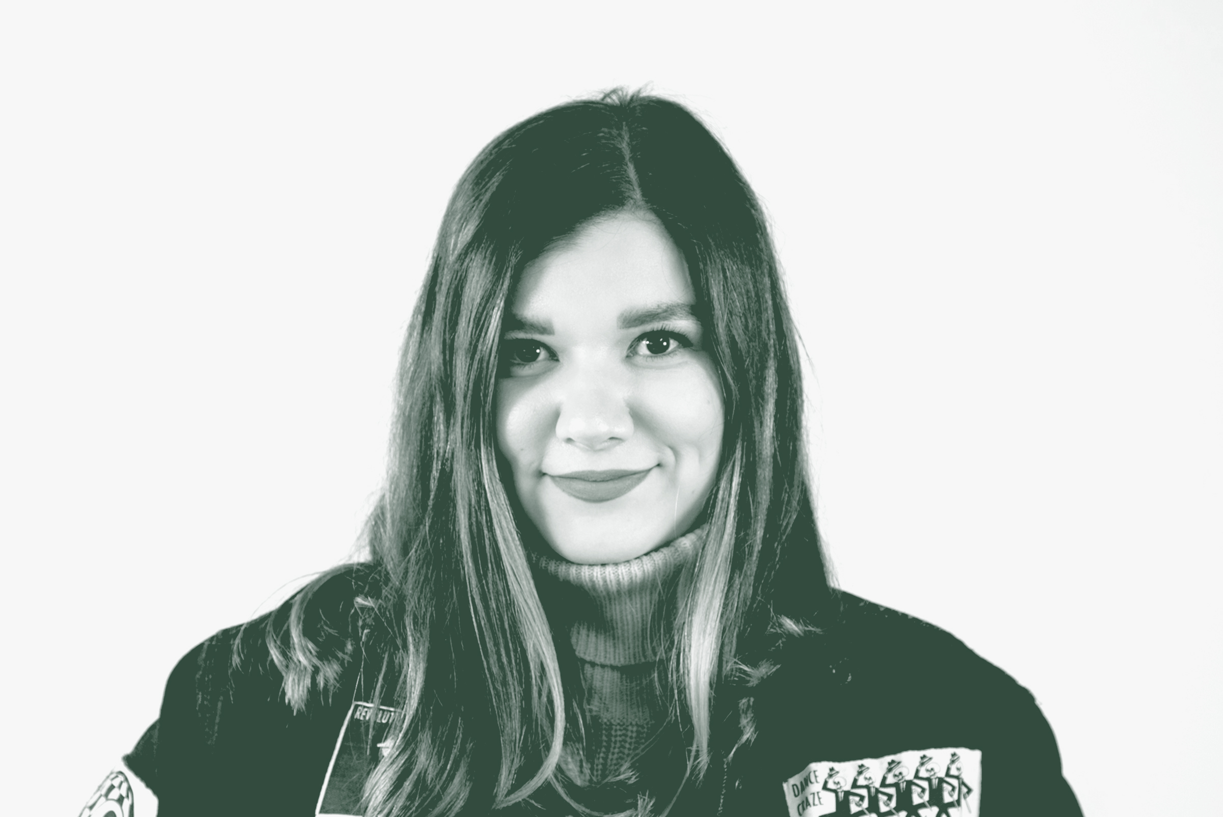 A black and white portrait of Cecilia Garcia, a Project Coordinator with GFF in the Fort Worth Studio, in front of a white background.