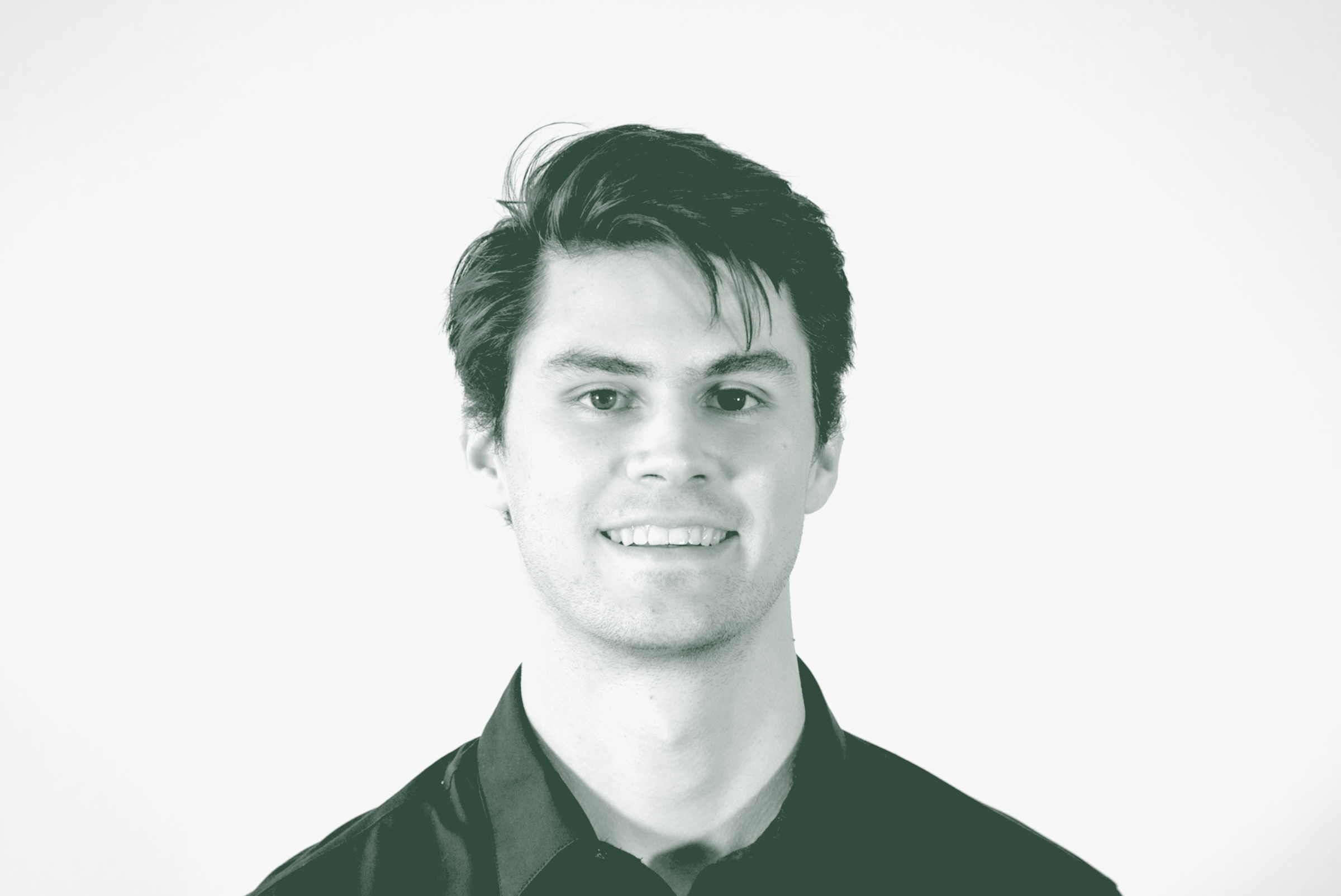 A black and white portrait of Coleman Brink, a Design Coordinator with GFF, in front of a white background.