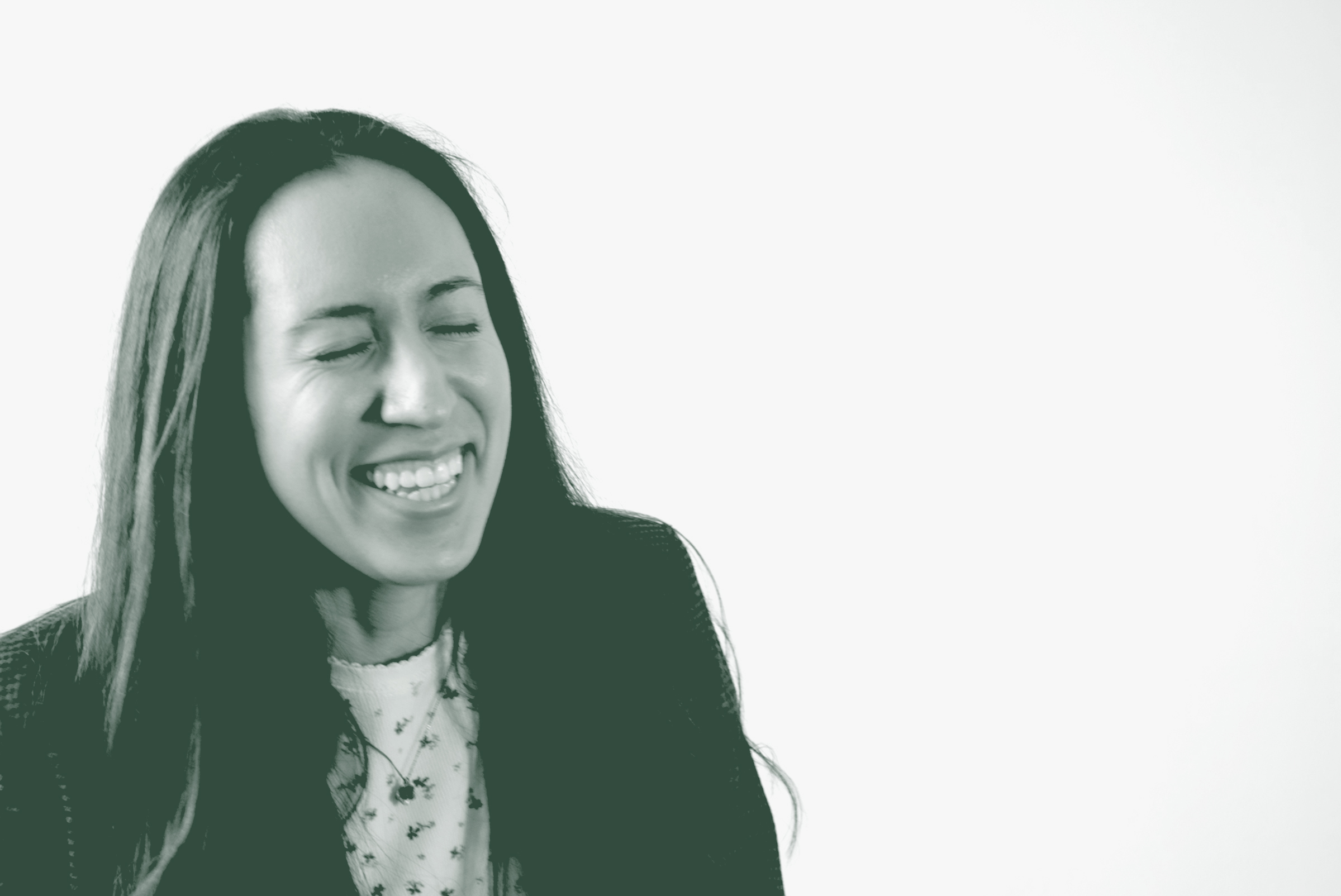 A black and white portrait of Marisa Dominguez, an Architectural Professional with GFF in the Mixed-Use & Multifamily Studio, in front of a white background.