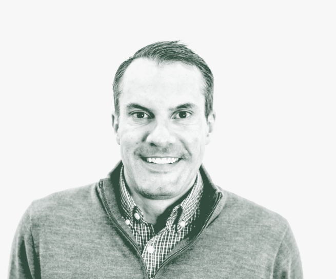 A black and white portrait of Bart Wilburn, a Senior HR Leader with GFF, in front of a white background.