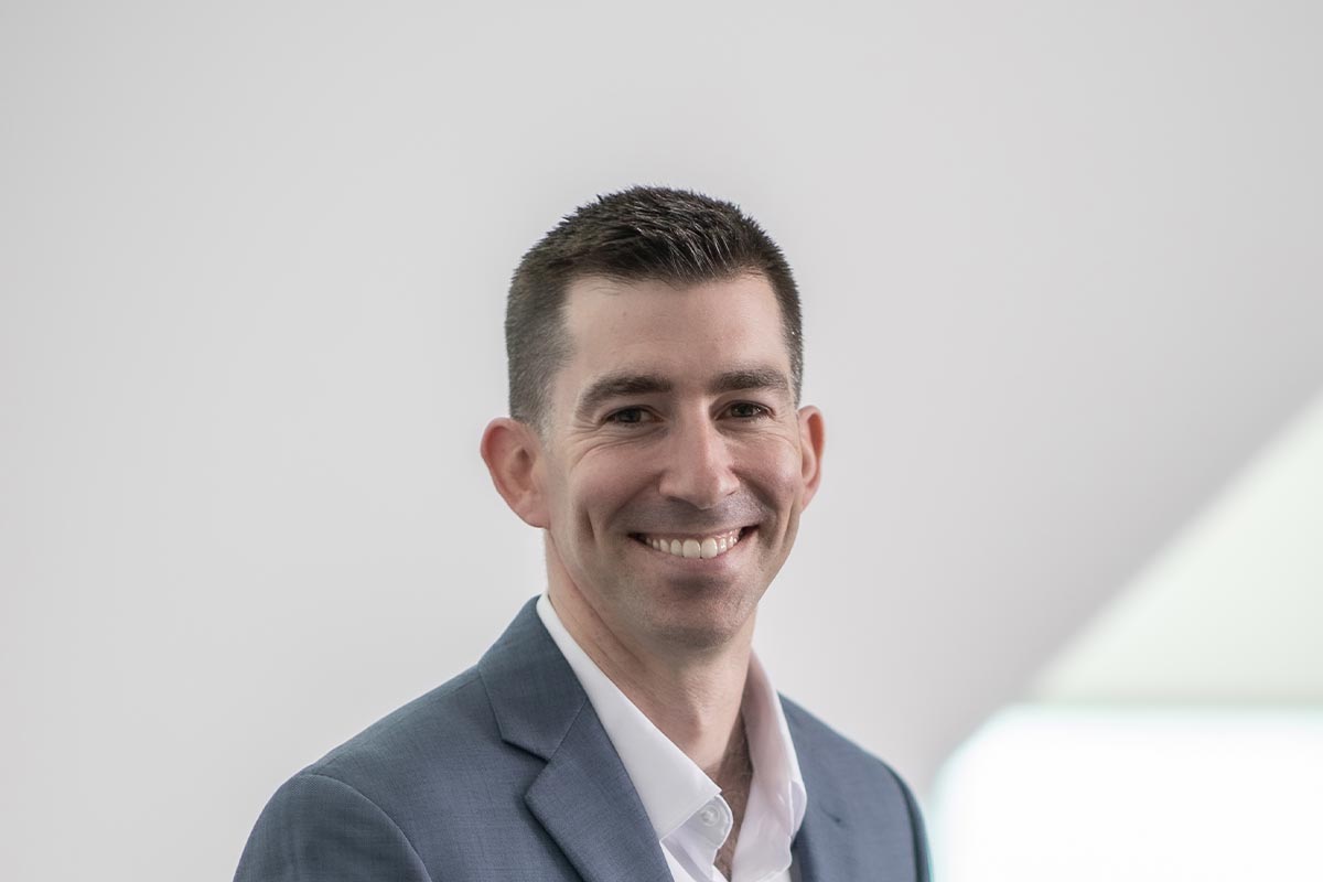 Cropped portrait of Adam Fenner, architect at GFF Dallas, LEED AP and RA