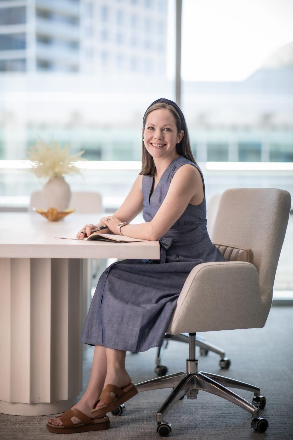 Amanda Kalescky, Senior Project Coordinator at GFF, photographed in a Dallas design firm office, workplace architect in a contemporary interior.