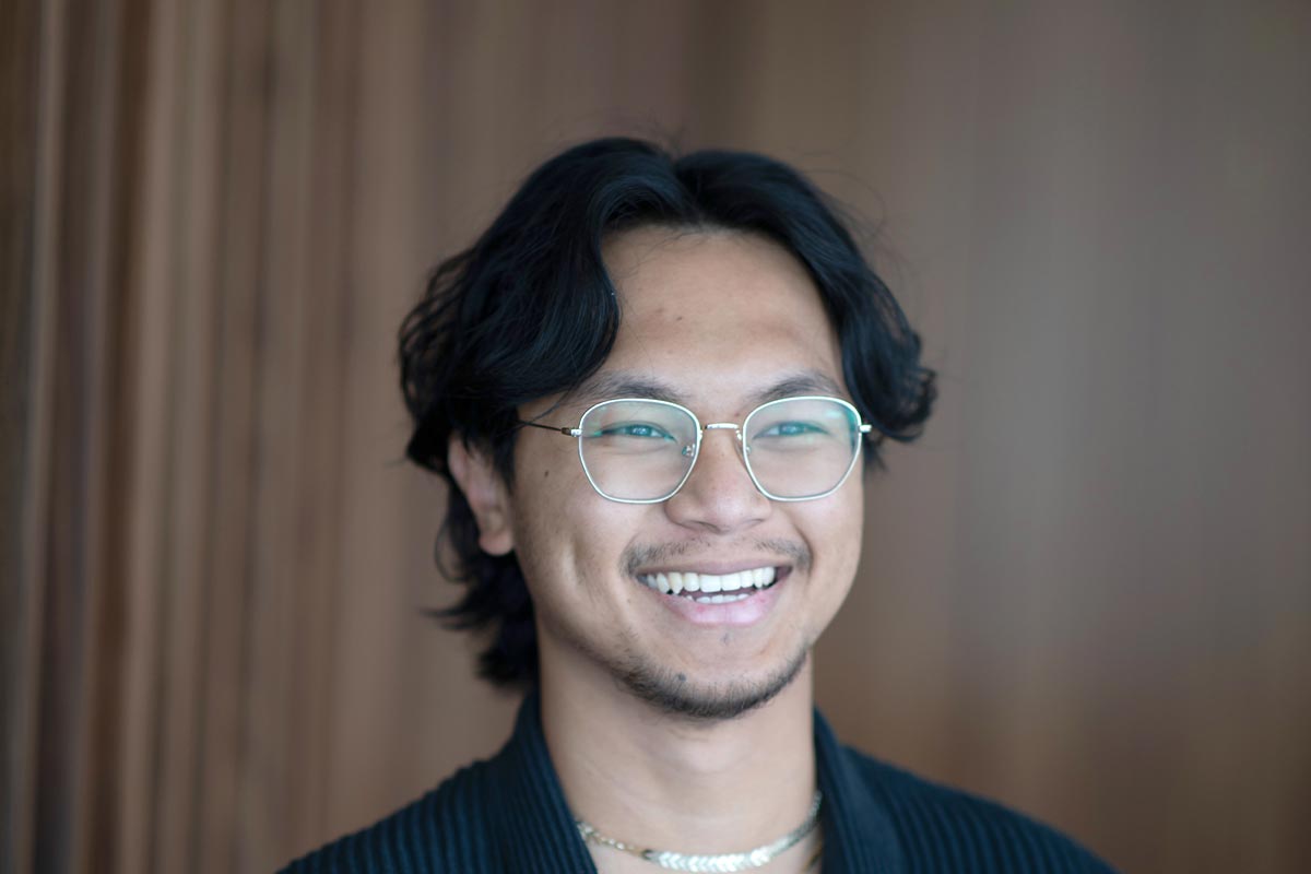 Vince Hernandez, Architectural Professional at GFF Austin, close-up professional portrait in a contemporary design firm setting.