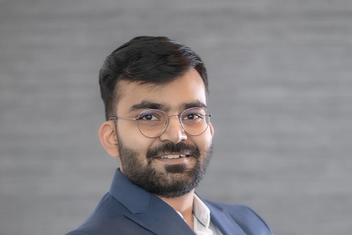 Nikunj Vara, Architectural Professional at GFF, close-up professional portrait in a modern design firm setting.