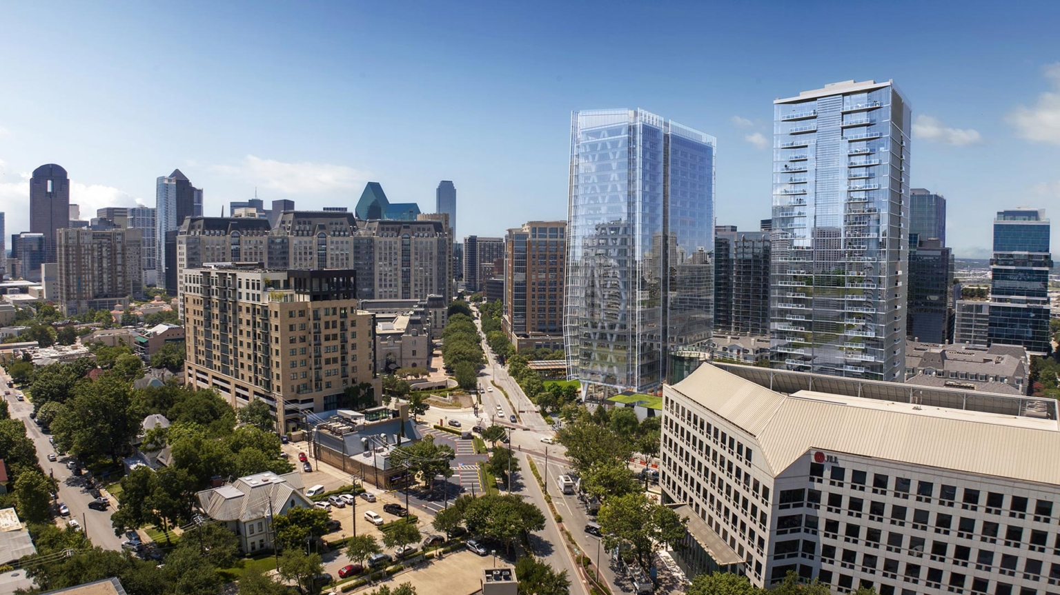 Daytime aerial view of 23Springs in Uptown Dallas, showing the tower along Cedar Springs Road with nearby office and residential buildings.