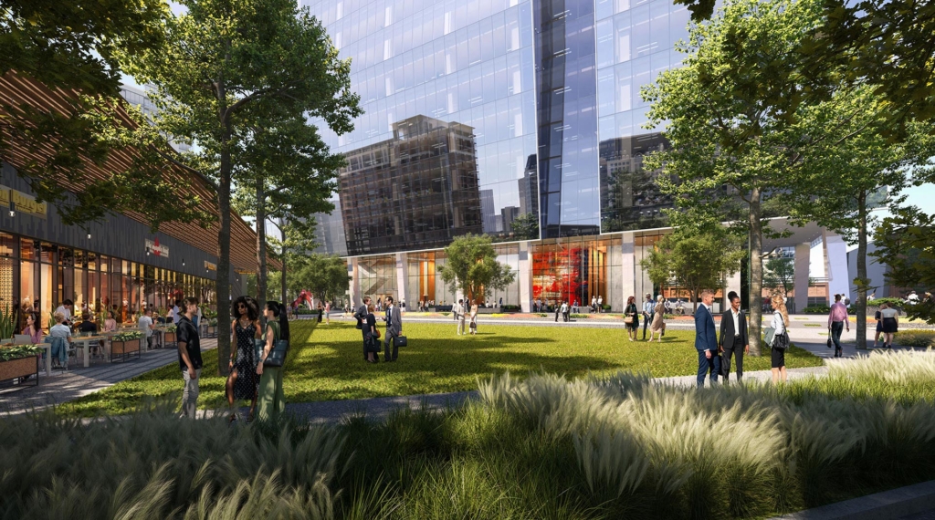 Lawn Ground-level view of 23Springs showing retail pavilions, outdoor dining, public green space, and the tower’s glass façade.