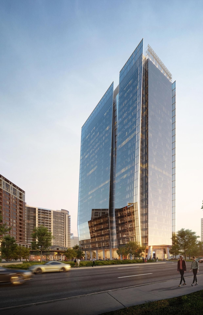 Street View Angled view of the 23Springs high-rise office tower in Dallas, showing the glass façade catching late afternoon light.