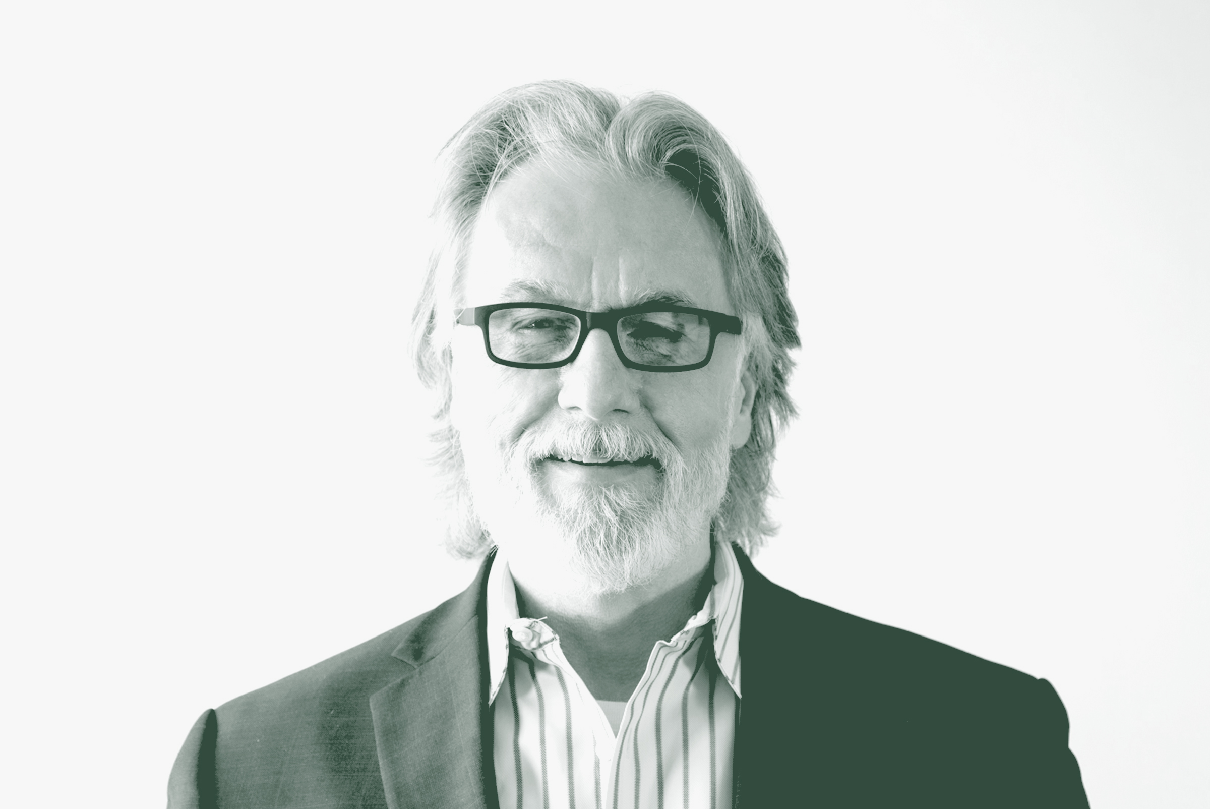 A black and white portrait of Brian Kuper, the Design Principal with GFF, in front of a white background.