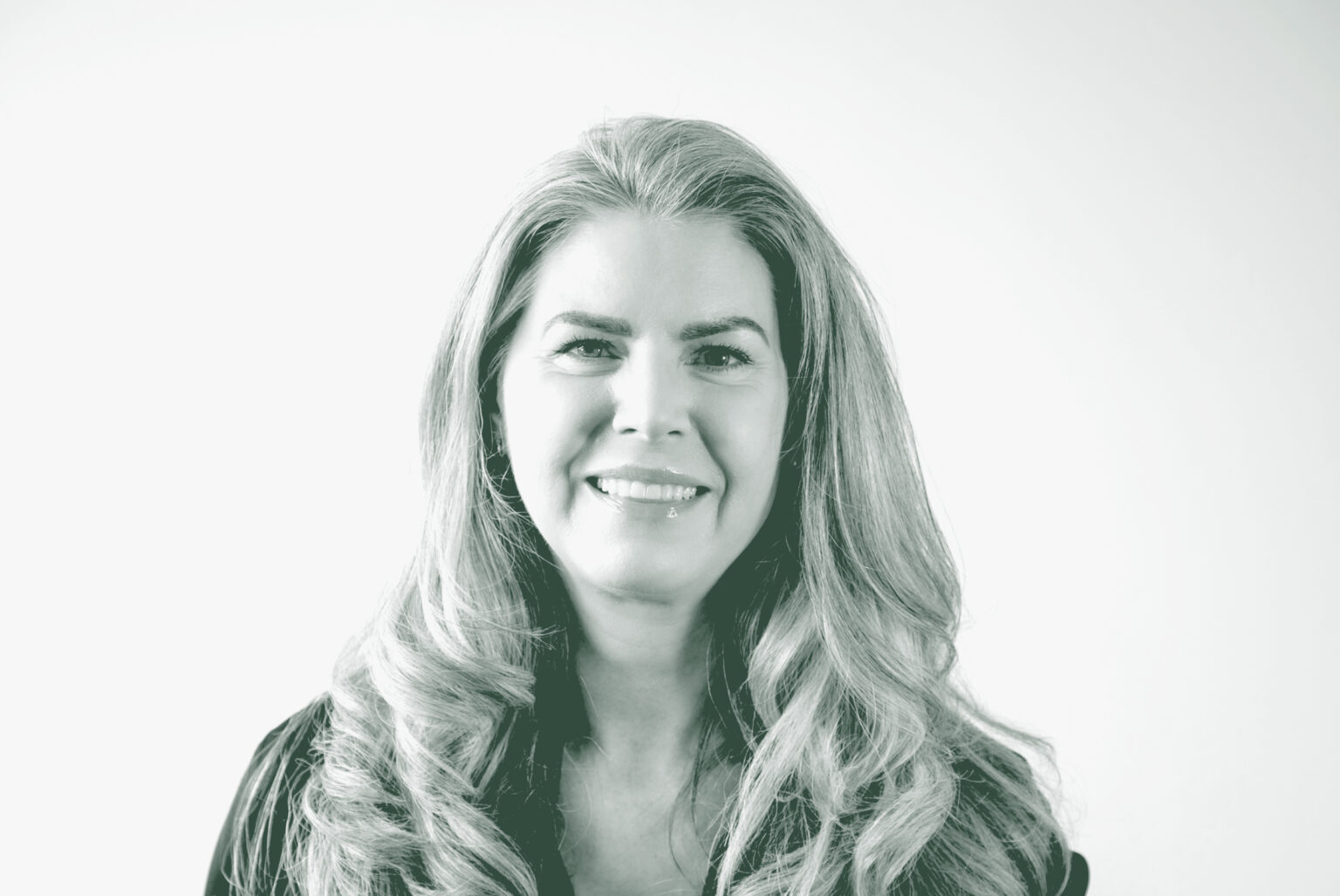 A black and white portrait of Danielle Davis, an Associate and the Director of Accounting with GFF, in front of a white background.