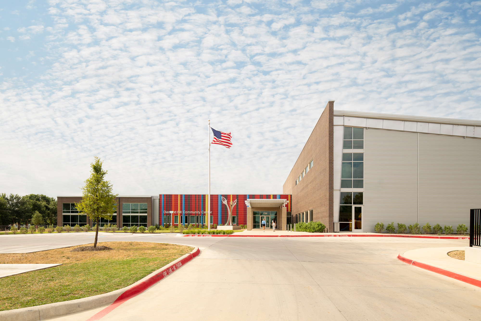 The main entrance of the Diamond Hill Community Center, featuring a colorful facade and a prominent American flag.