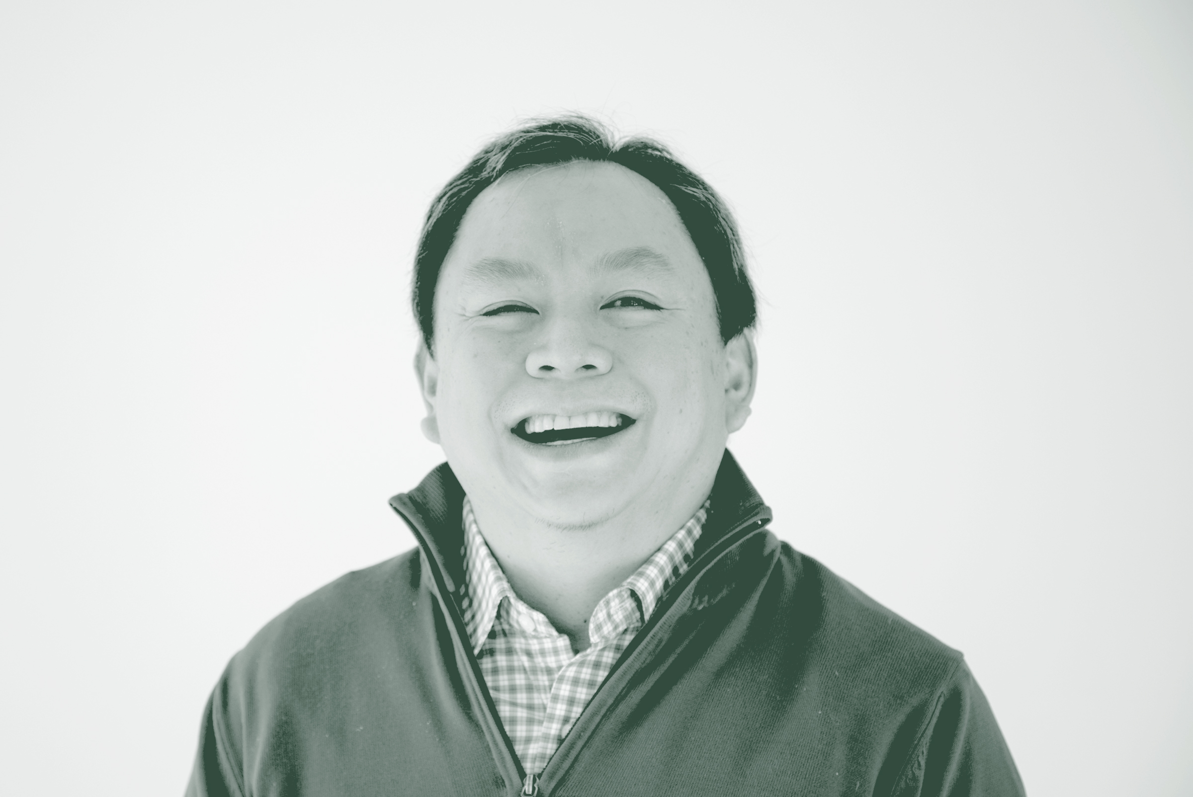 A black and white portrait of Ervin Hirsan, a Senior Project Coordinator with GFF in the Mixed-Use & Multifamily Studio, in front of a white background.