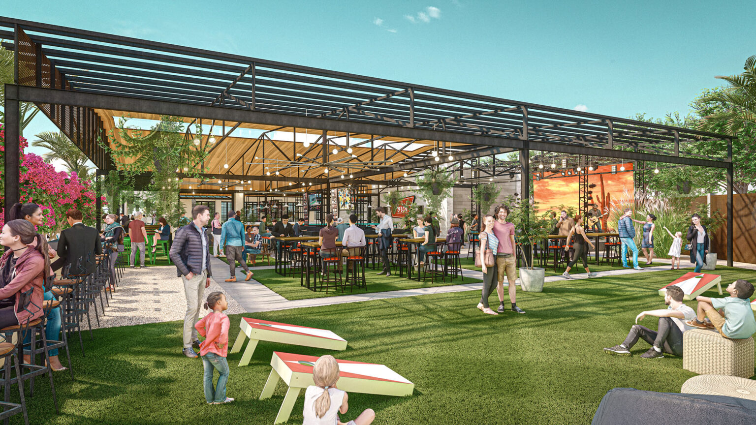 People enjoying indoor-outdoor restaurant space with seating and activities.