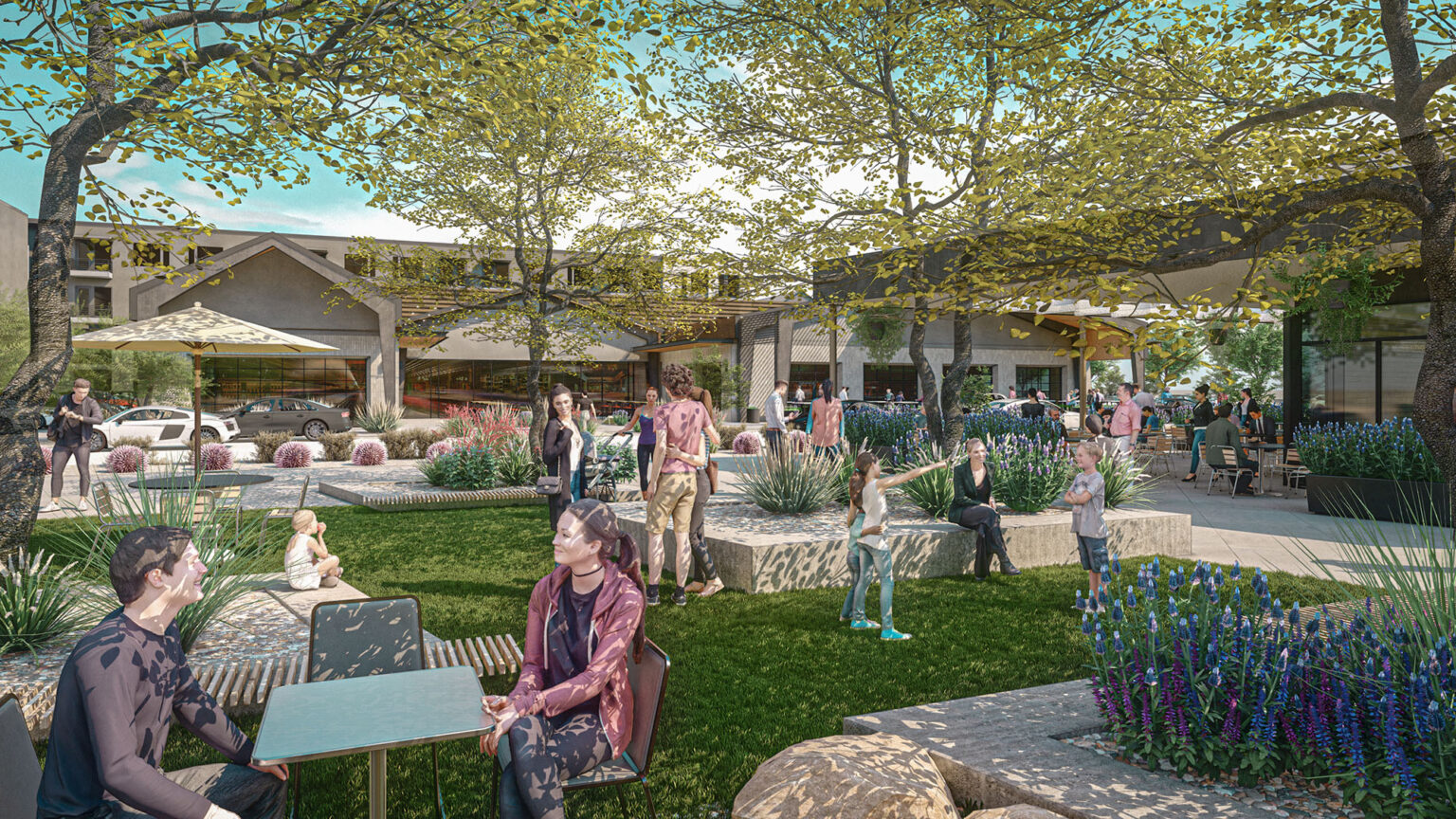 People enjoying a garden and seating area with trees and plants.