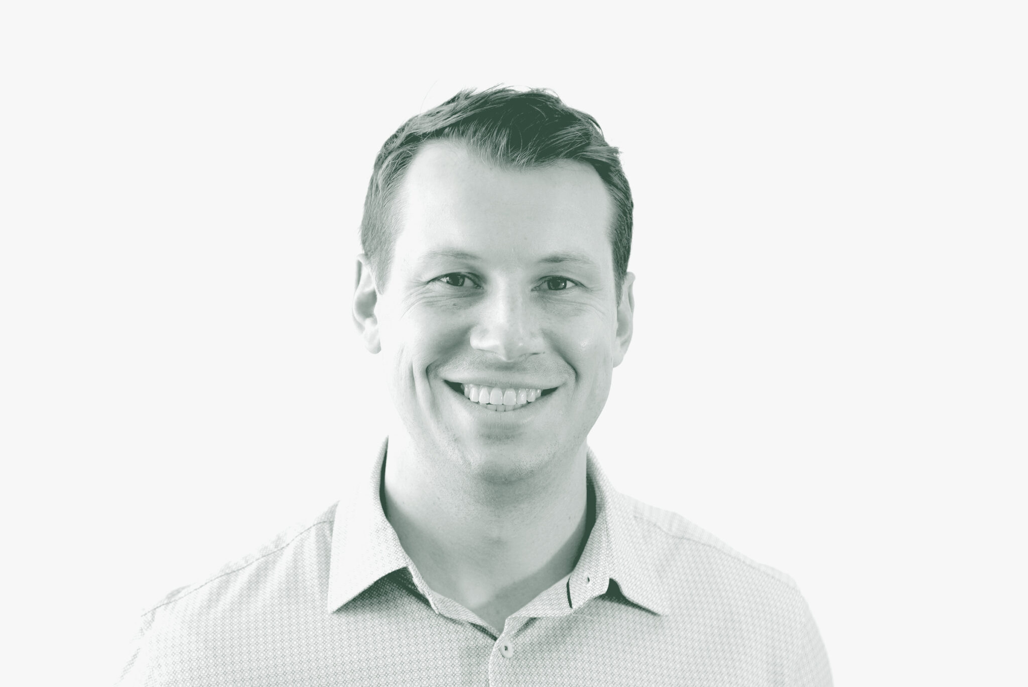 A black and white portrait of Garrett Barker, an Associate and Studio Director with GFF in the Civic & Cultural Studio, in front of a white background.