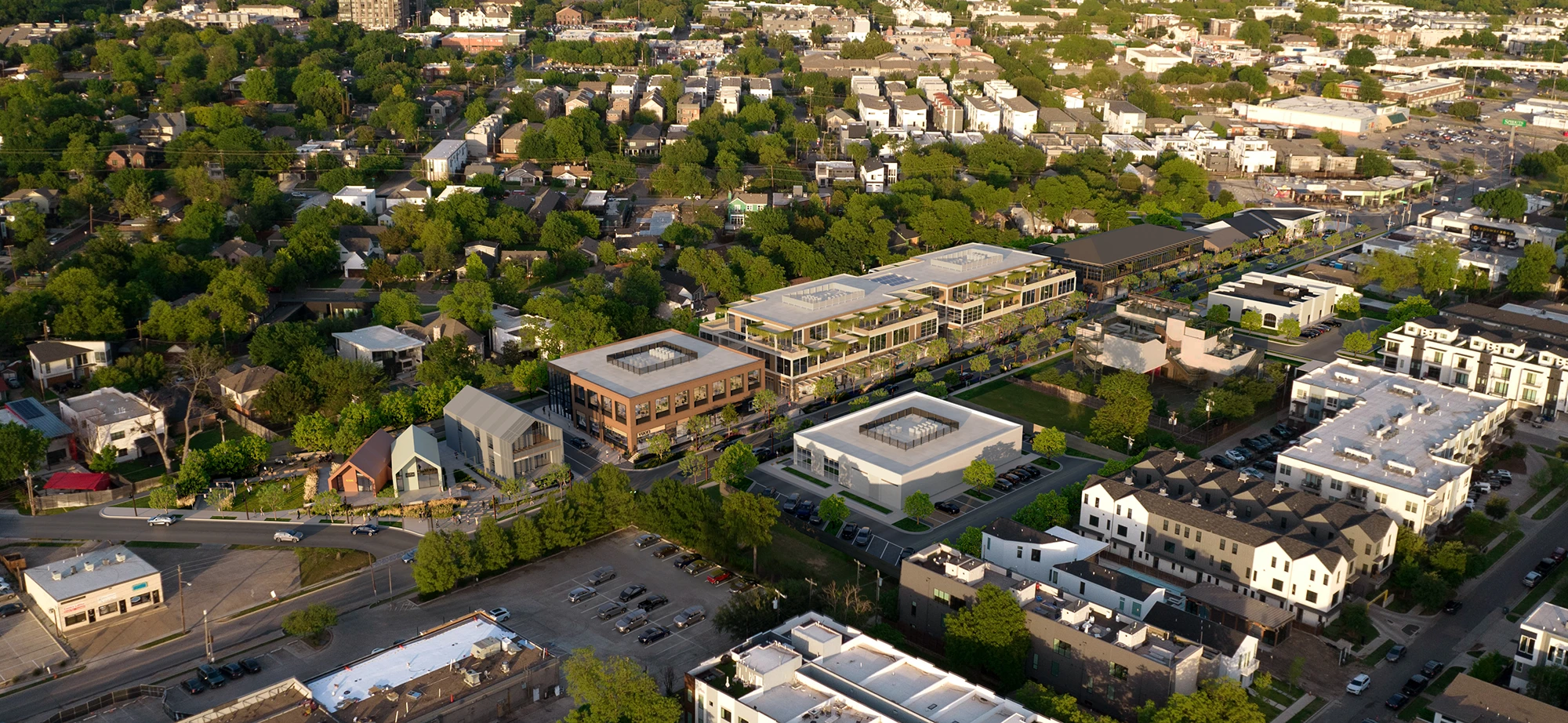 Aerial rendering of the Henderson Avenue Mixed-Use development in Dallas, Texas, showing a 3.55-acre site with a blend of retail and office spaces integrated into a walkable streetscape.