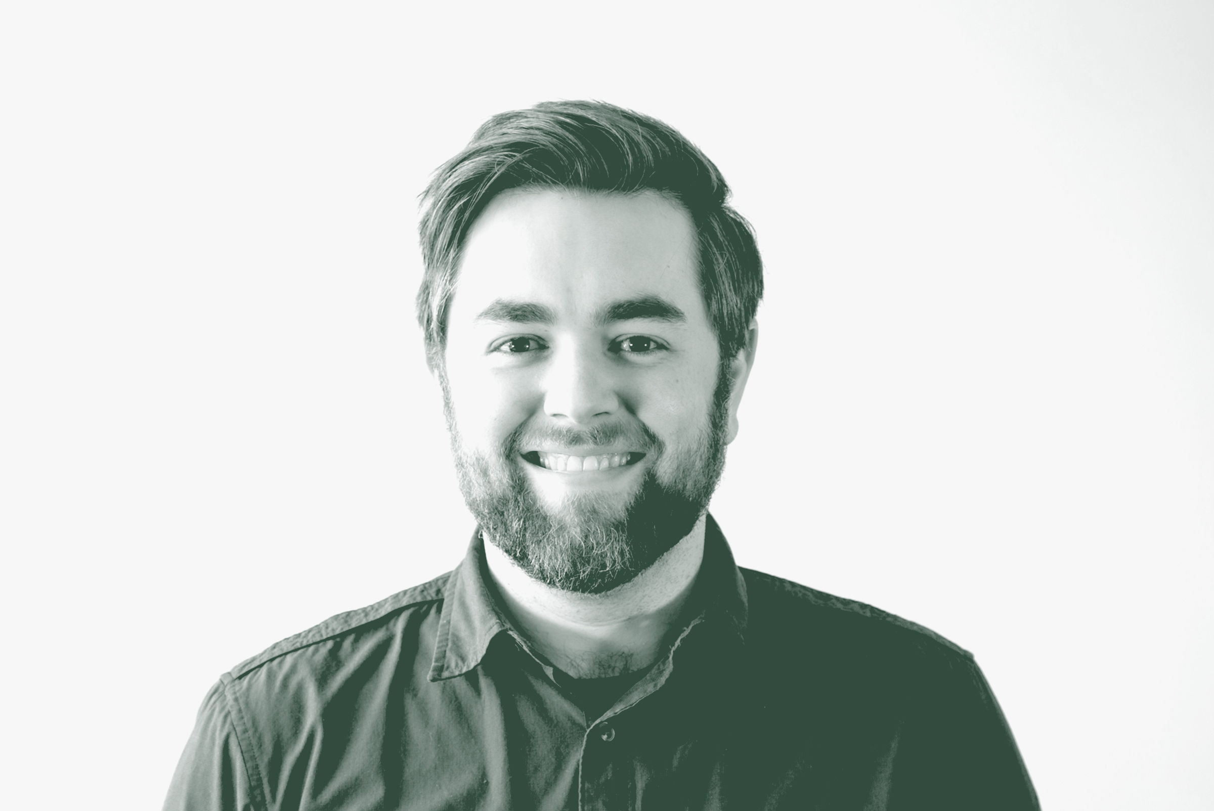 A black and white portrait of Josh Frederick, an Associate and Project Leader with GFF in the Mixed-Use & Multifamily Studio, in front of a white background.