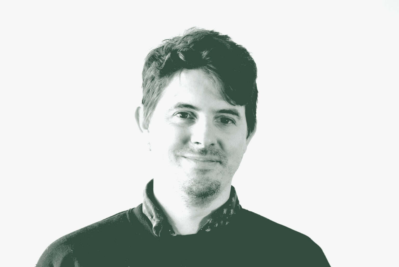 A black and white portrait of Levi Hooten, an Associate and Senior Creative Leader with GFF, in front of a white background.