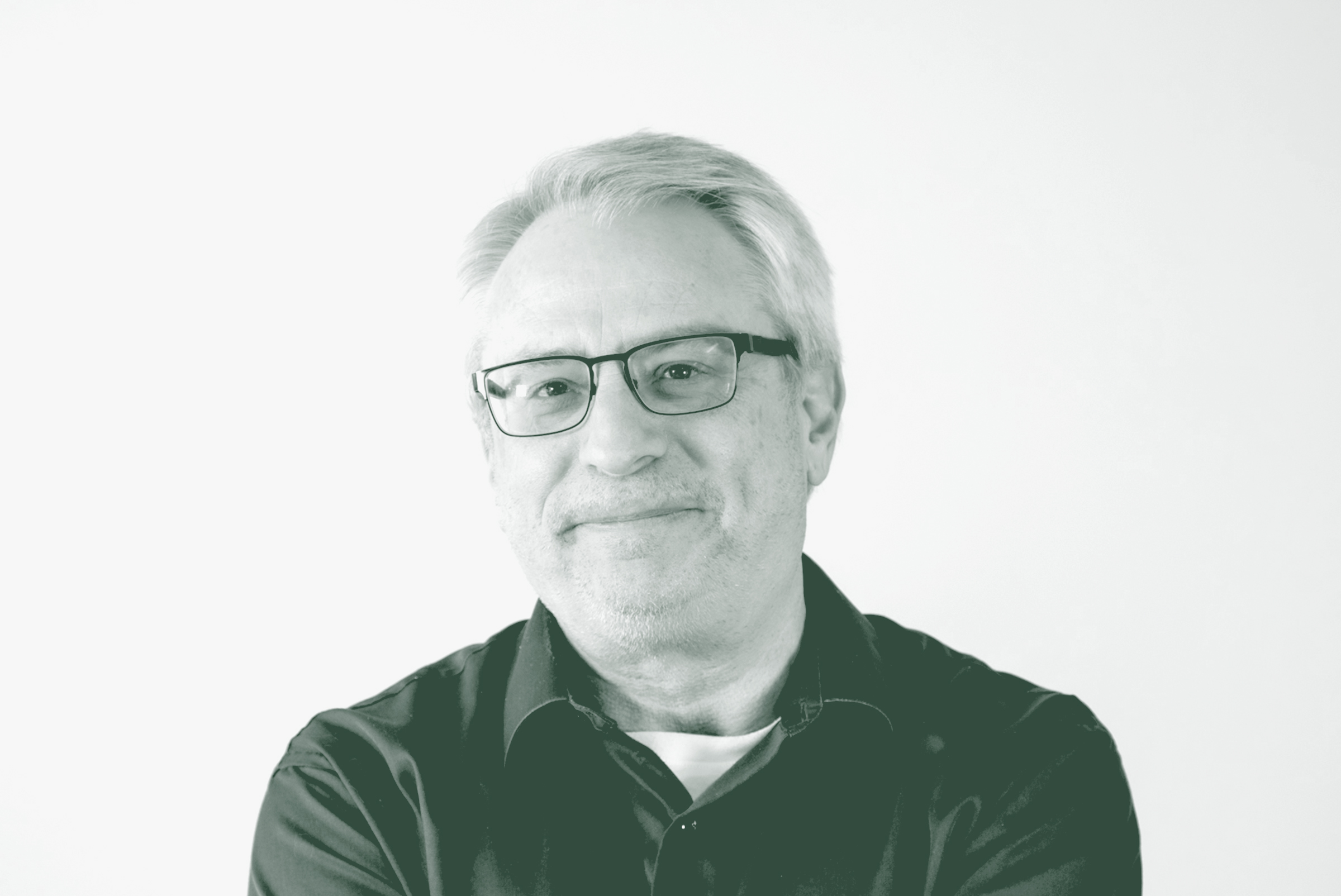 A black and white portrait of Lonnie Burns, an Associate Principal and Studio Director with GFF in the Fort Worth Studio, in front of a white background.