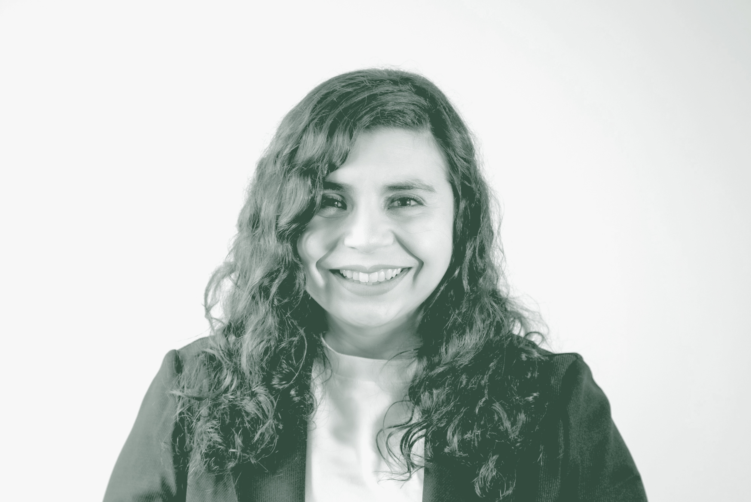 Mariah Trevizo Portrait A black and white portrait of Mariah Trevizo, an Associate and Senior Project Coordinator with GFF in the Mixed-Use & Multifamily Studio, in front of a white background.