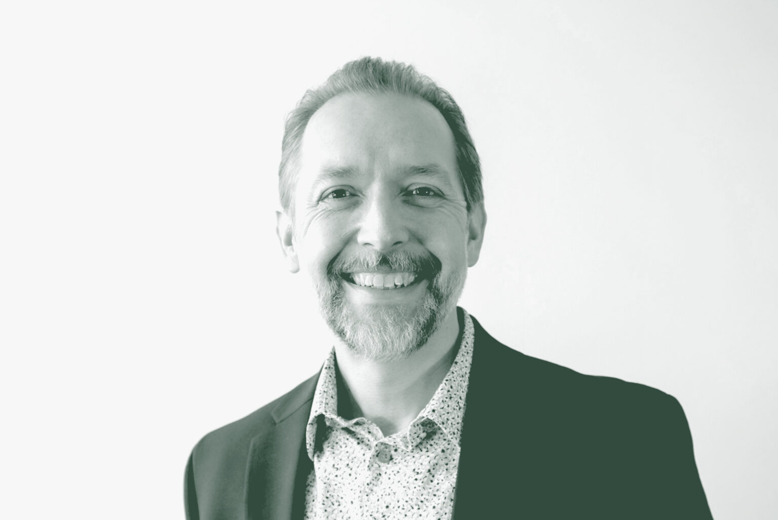 A black and white portrait of Mike Lehr, an Associate Principal and Studio Director with GFF in the Faith & Community Studio, in front of a white background.