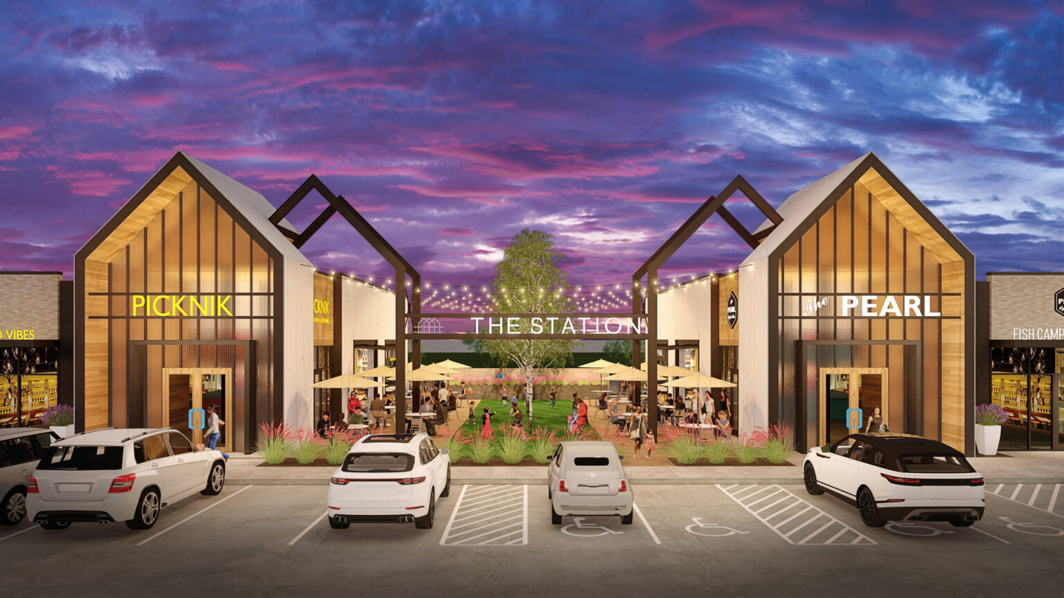 Parking lot entrance to The Station - Sachse with evening sky