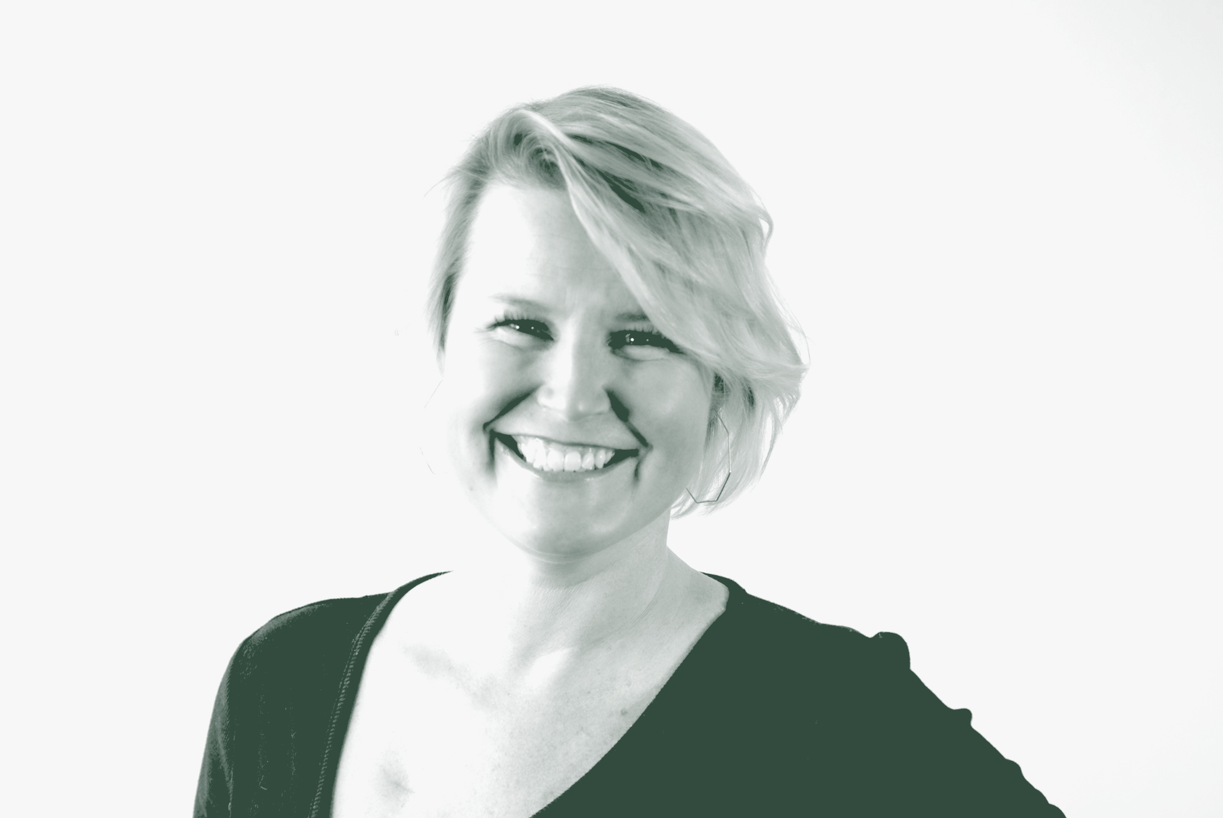 A black and white portrait of Taylor Catalano, an Associate and an HR Leader with GFF, in front of a white background.