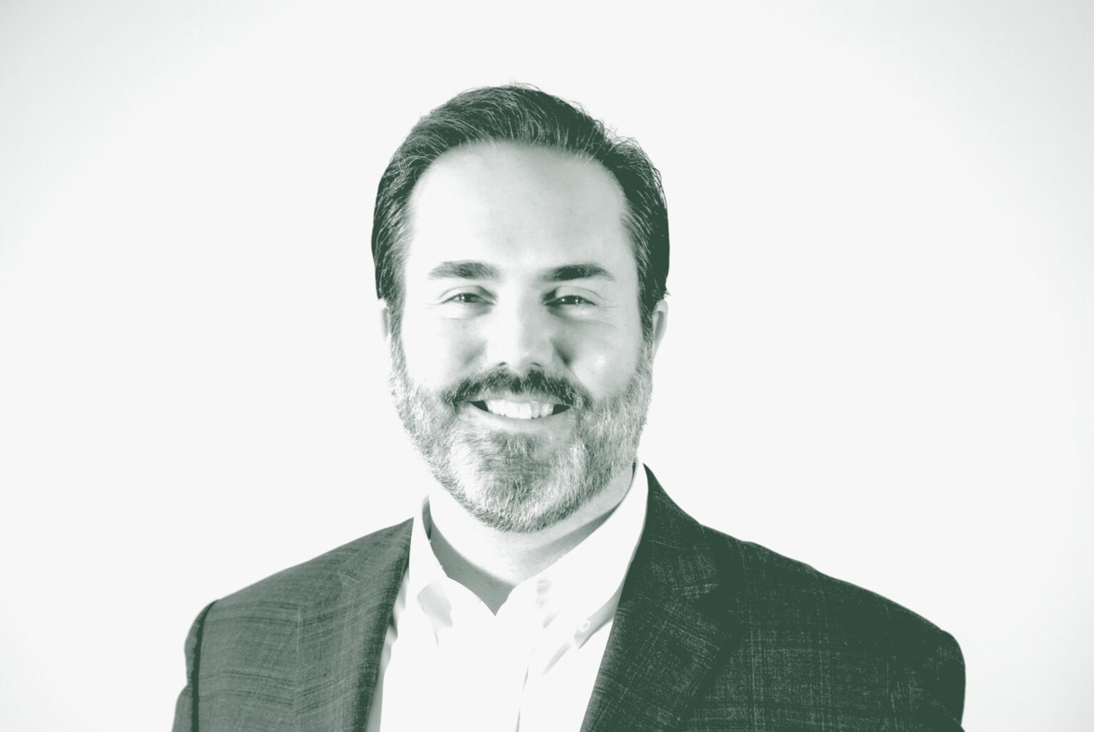 A black and white portrait of Todd Burtis, a Design Principal with GFF, in front of a white background.