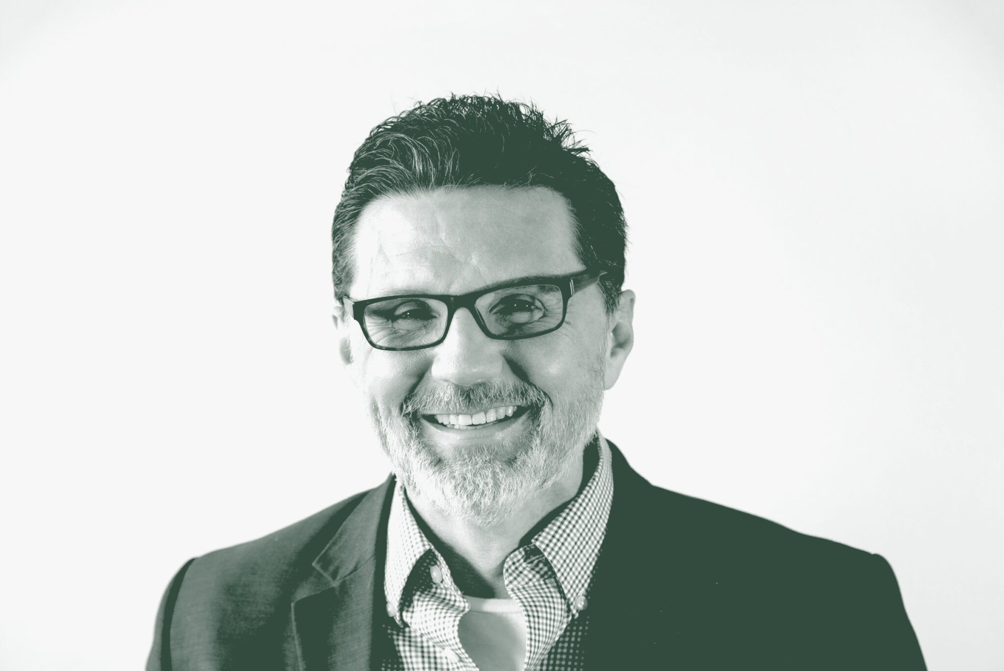 A black and white portrait of Todd Toupal, an Associate and the Technical Director with GFF, in front of a white background.
