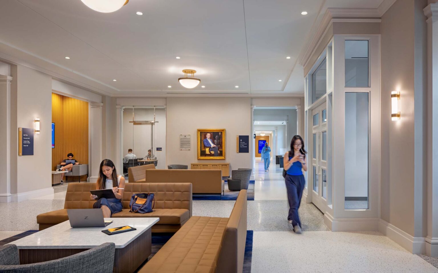 Interior student commons at the SMU Cox School of Business featuring lounge seating, study areas, and circulation corridors with natural light.