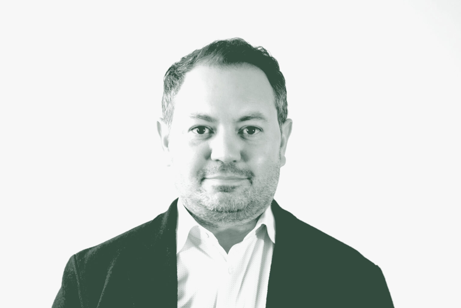 A black and white portrait of David Rosenbloom, a Senior Design Leader with GFF in the Office & Workplace Studio, in front of a white background.