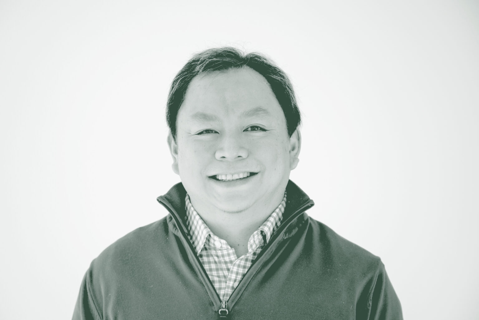 A black and white portrait of Ervin Hirsan, a Senior Project Coordinator with GFF in the Mixed-Use & Multifamily Studio, in front of a white background.